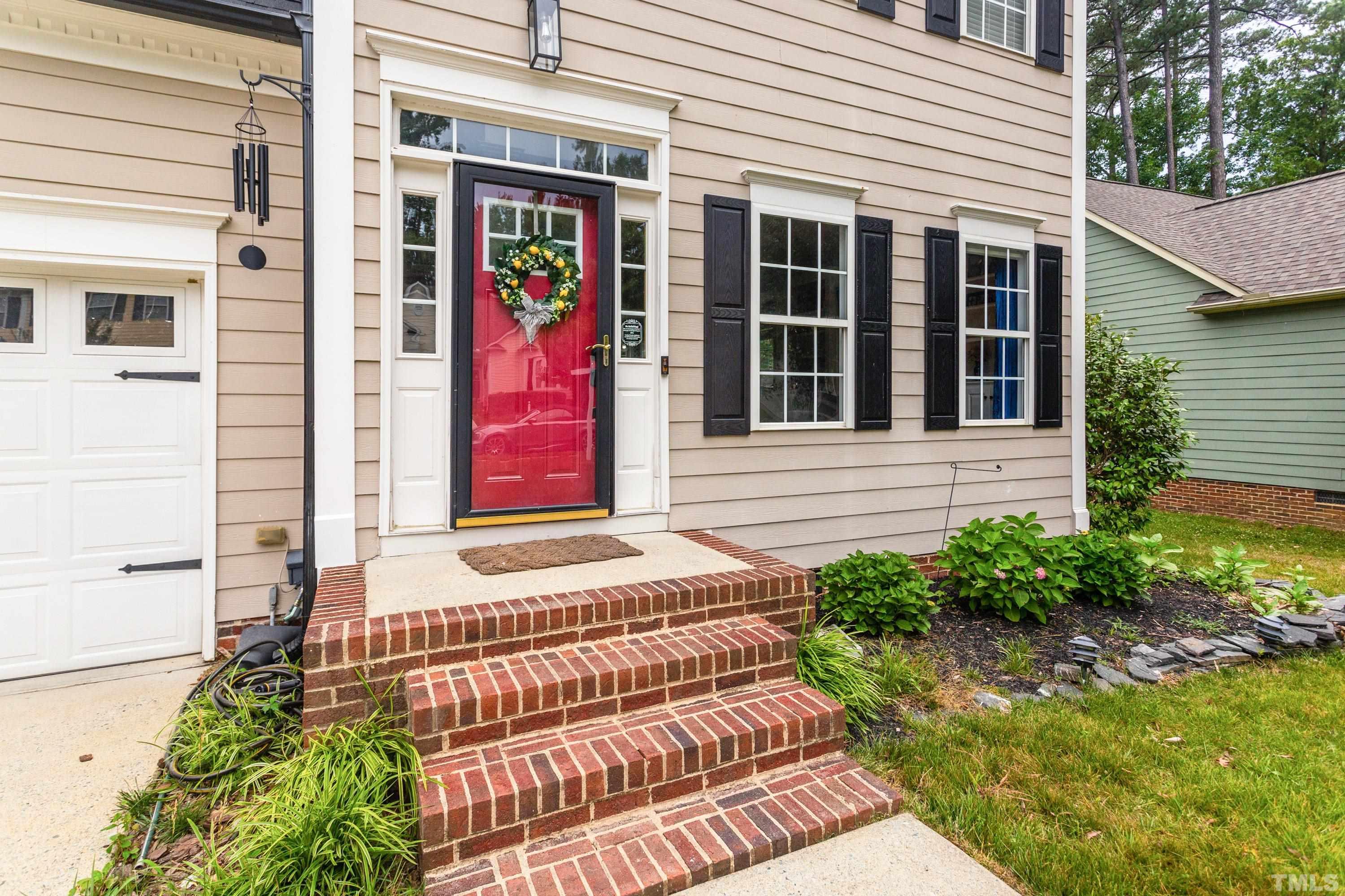 9229 Shallcross Way Raleigh, NC 27617 - Photo 5 of 38 a front view of a house with garden