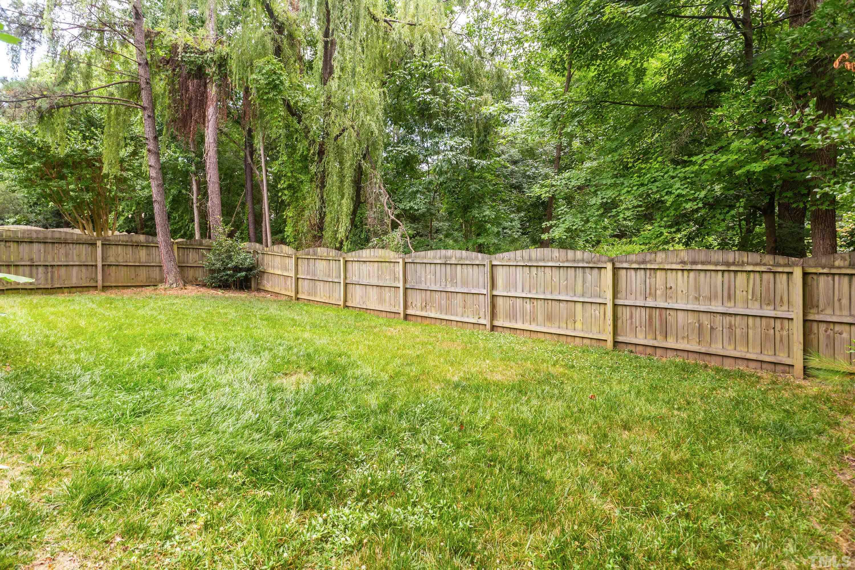 9229 Shallcross Way Raleigh, NC 27617 - Photo 6 of 38 a view of backyard with green space