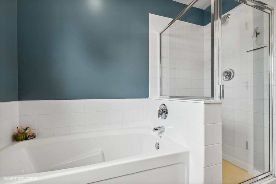 1417 Roth Drive Joliet, IL 60431 - Photo 12 of 18 a bathroom with a bathtub and a shower