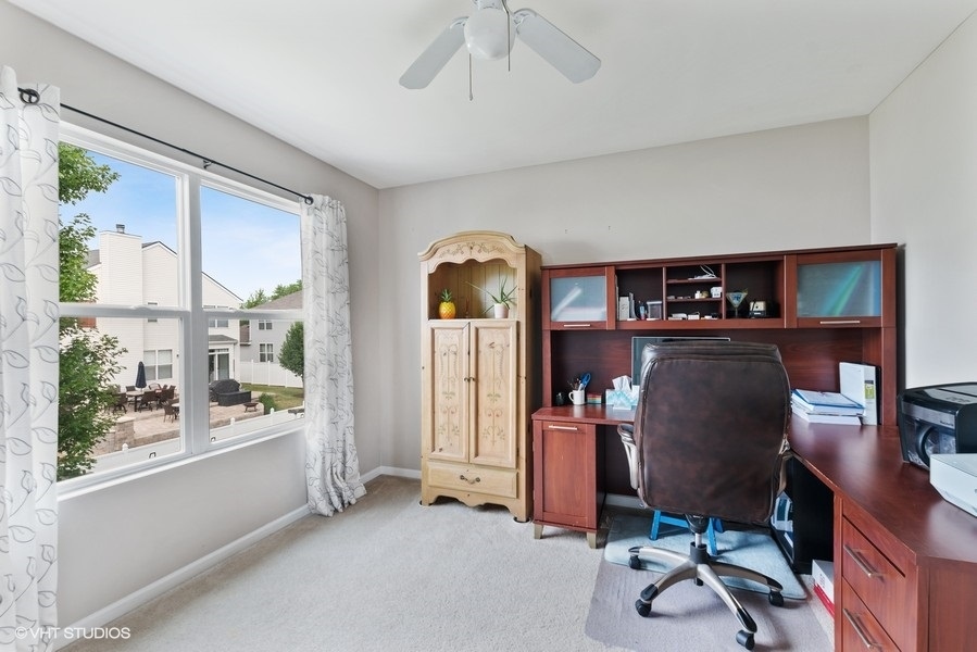 1417 Roth Drive Joliet, IL 60431 - Photo 15 of 18 a view of a workspace with furniture and a window