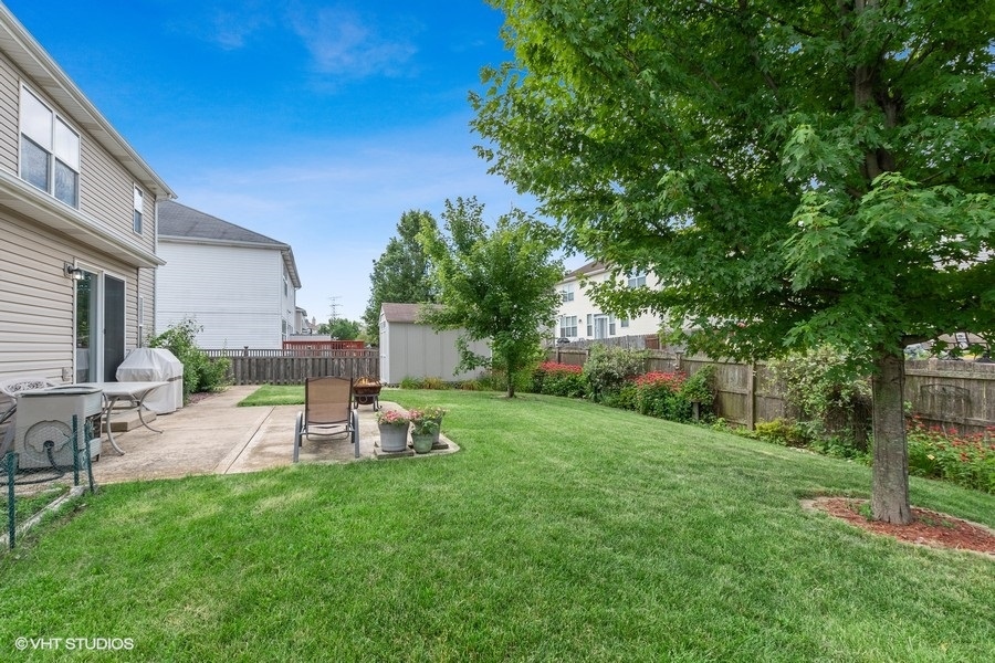 1417 Roth Drive Joliet, IL 60431 - Photo 18 of 18 a view of a backyard with sitting area