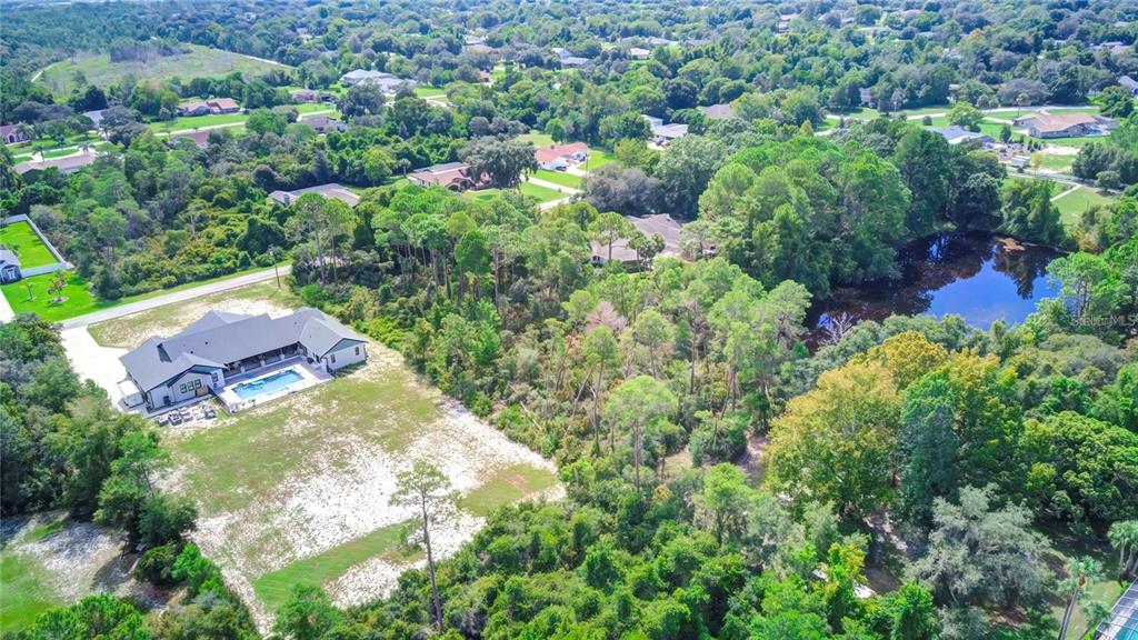 6067 Patricia Place Weeki Wachee, FL 34607 - Photo 17 of 21 an aerial view of a house with a yard