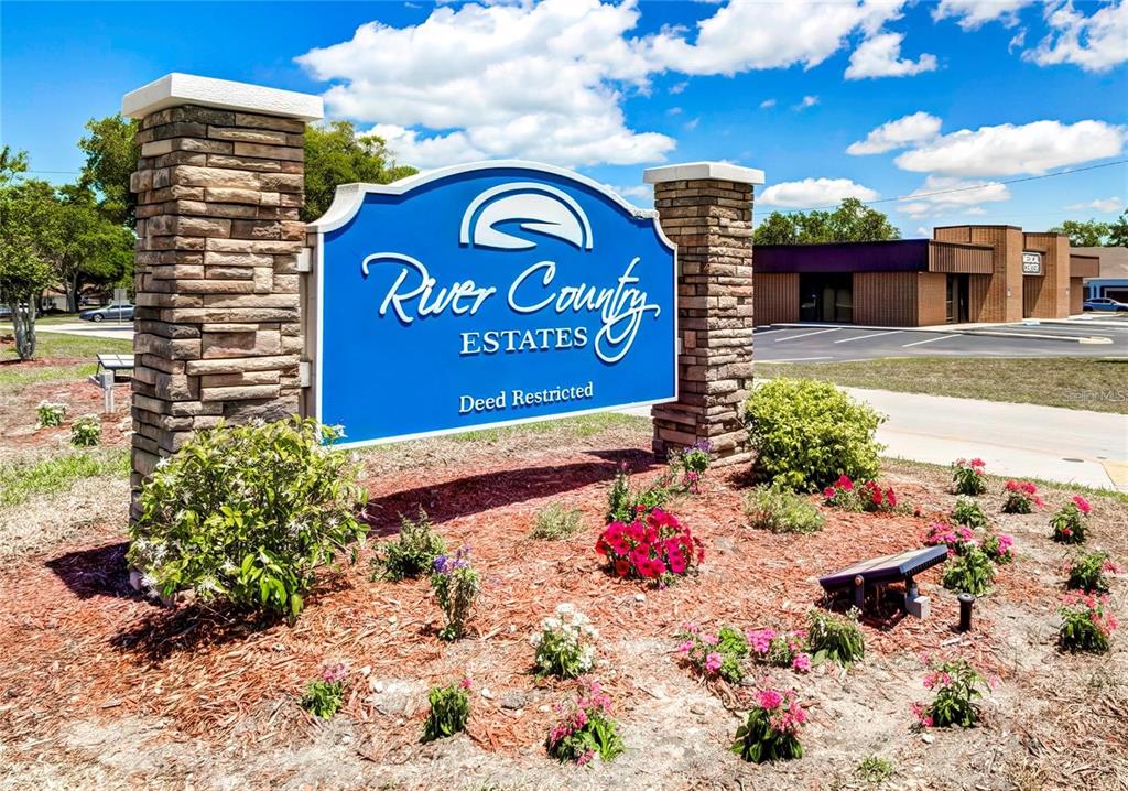 6067 Patricia Place Weeki Wachee, FL 34607 - Photo 5 of 21 a sign that is sitting in front of flowers