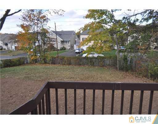 51 Farmingdale Road Fords, NJ 08863 - Photo 6 of 6 a balcony with trees in front of it