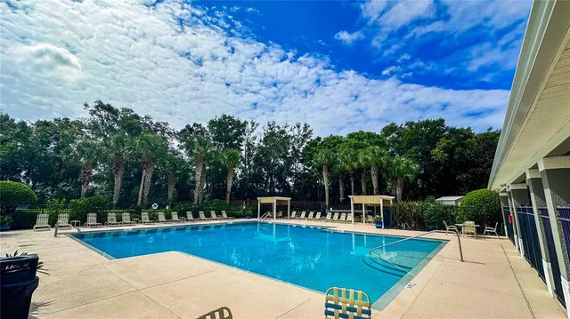 a view of a swimming pool with lounge chair
