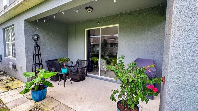 a front view of a house with flowers