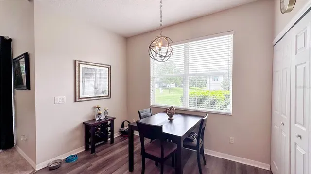 a view of a dining room with furniture window and outside view