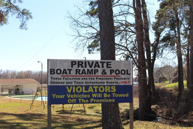 a view of a swimming pool with a table and chairs
