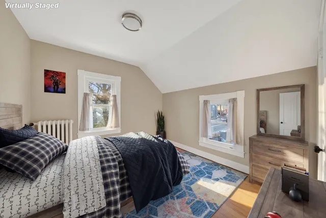 a bedroom with a bed and a couch