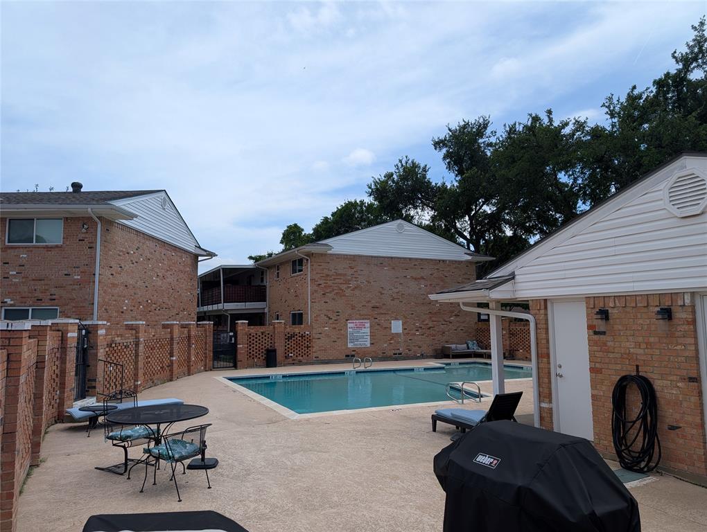 4715 Skillman Street, Unit A Dallas, TX 75206 - Photo 28 of 28 Outdoor swimming pool surrounded by a concrete deck