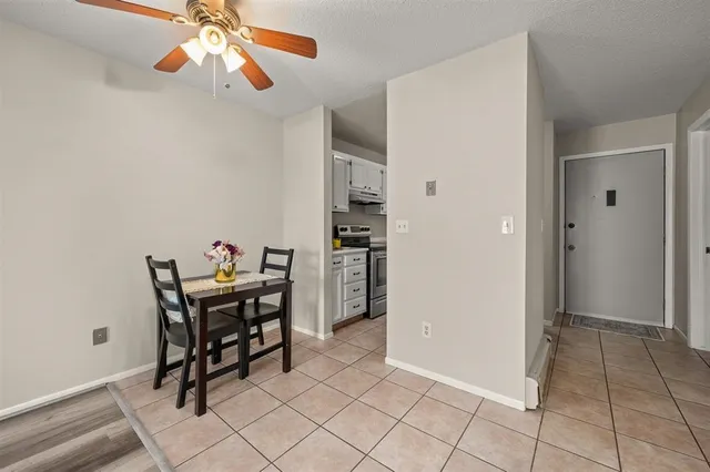 a kitchen with a sink a stove and cabinets