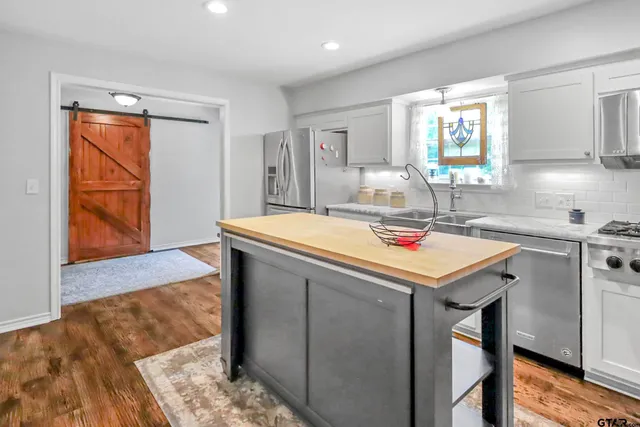 a kitchen with a sink and cabinets