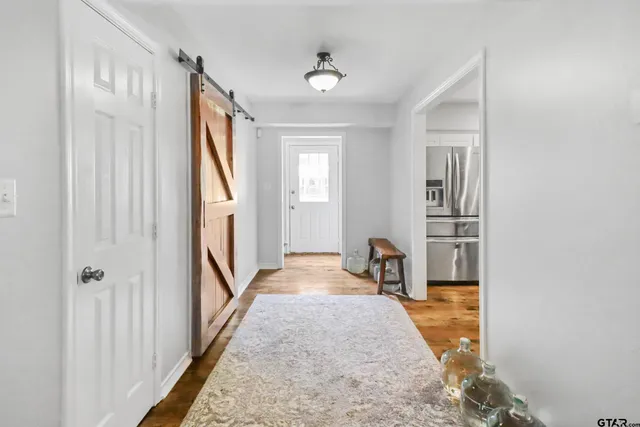 a view of entryway with wooden floor