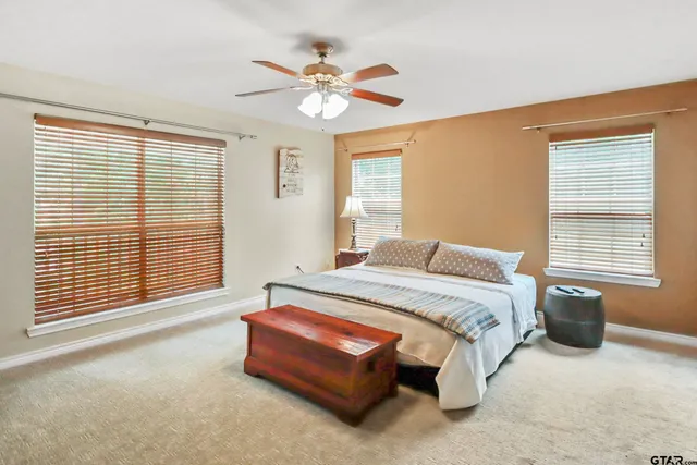 a white bath tub sitting next to a window