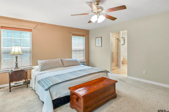 a bathroom with a shower a toilet and a sink