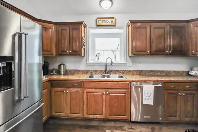 a kitchen with a sink stove and microwave
