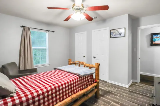 a bedroom with a bed and a table in it