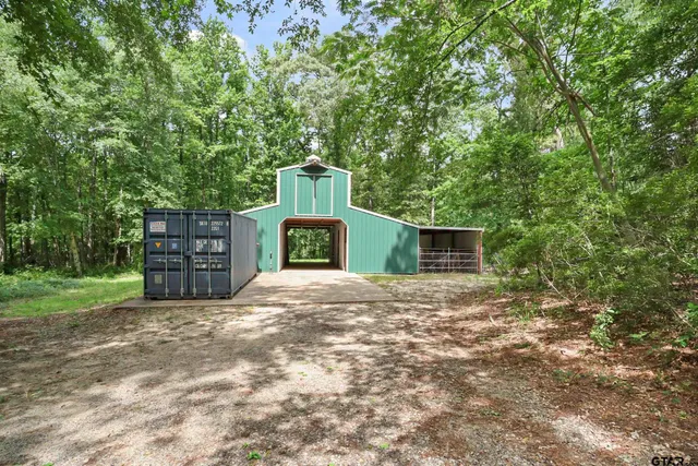 a view of a backyard with wooden floor and outdoor space