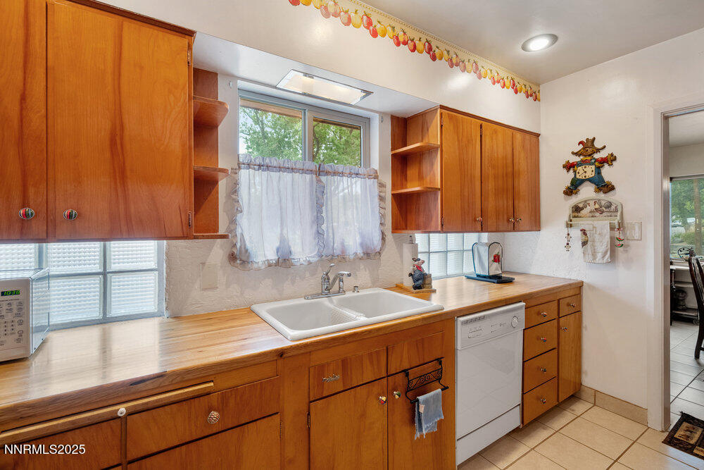 290 Circle Drive Reno, NV 89509 - Photo 11 of 22 a kitchen with a sink cabinets and window