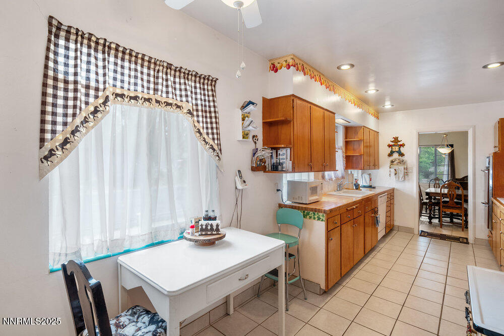 290 Circle Drive Reno, NV 89509 - Photo 12 of 22 a kitchen with stainless steel appliances granite countertop a stove a sink and a refrigerator