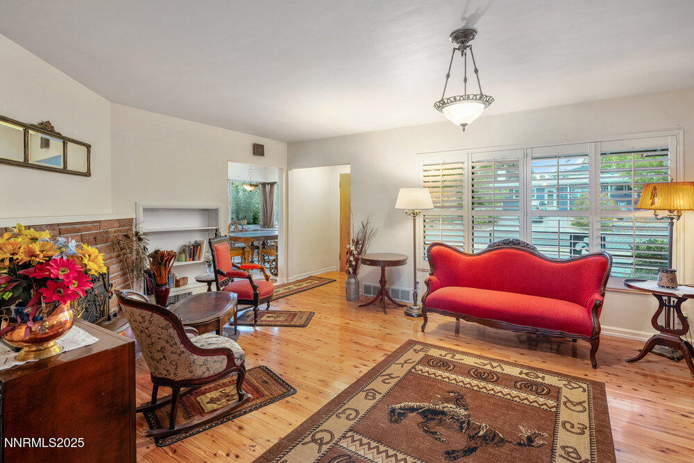 290 Circle Drive Reno, NV 89509 - Photo 4 of 22 a living room with furniture a rug and a chandelier