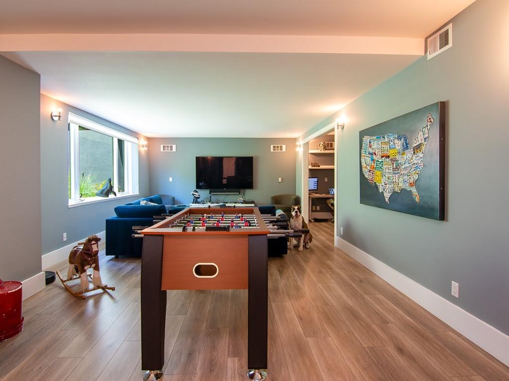 3600 Tripp Road Woodside, CA 94062 - Photo 14 of 27 a view of a workspace with furniture and a flat screen tv