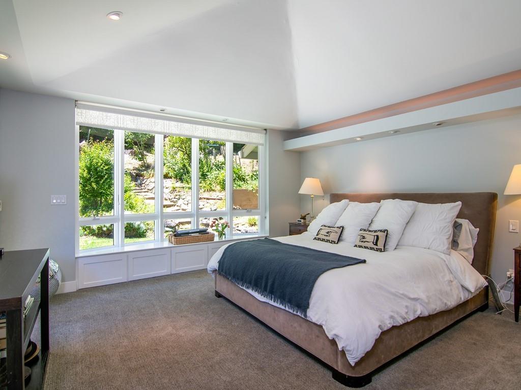 3600 Tripp Road Woodside, CA 94062 - Photo 15 of 27 a bedroom with a bed and a large window