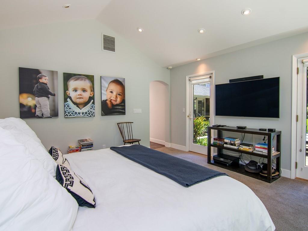 3600 Tripp Road Woodside, CA 94062 - Photo 16 of 27 a bedroom with a bed and a flat screen tv