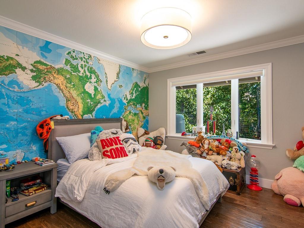 3600 Tripp Road Woodside, CA 94062 - Photo 20 of 27 a bedroom with a bed and a large window