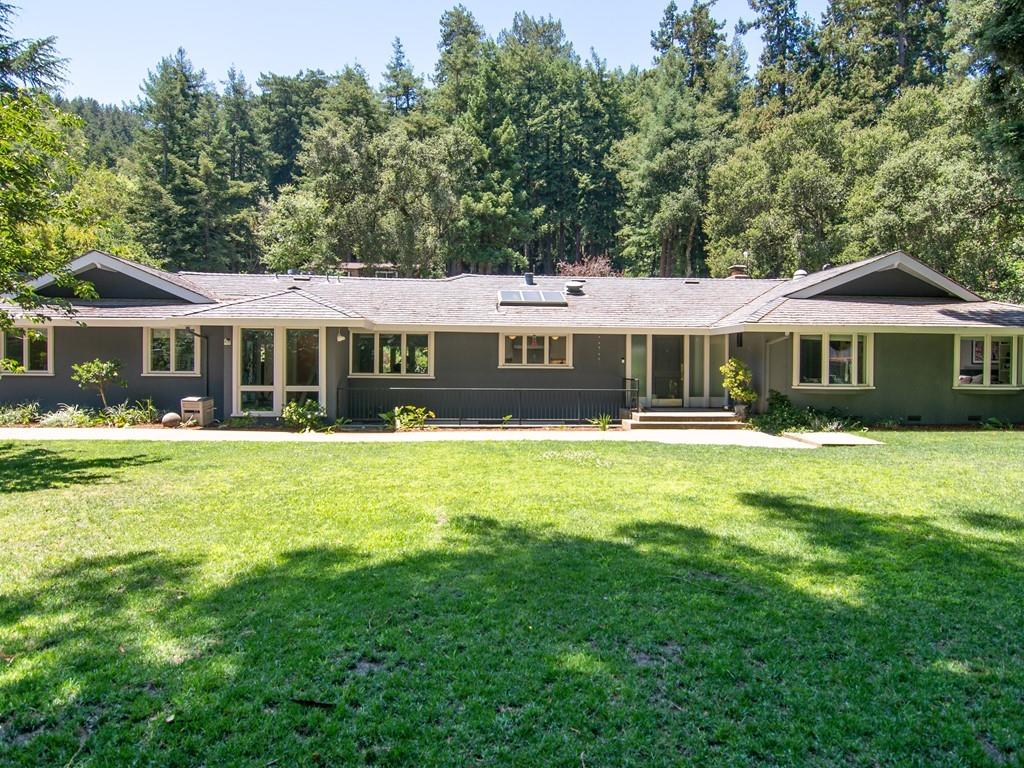 3600 Tripp Road Woodside, CA 94062 - Photo 2 of 27 a front view of a house with a yard table and chairs