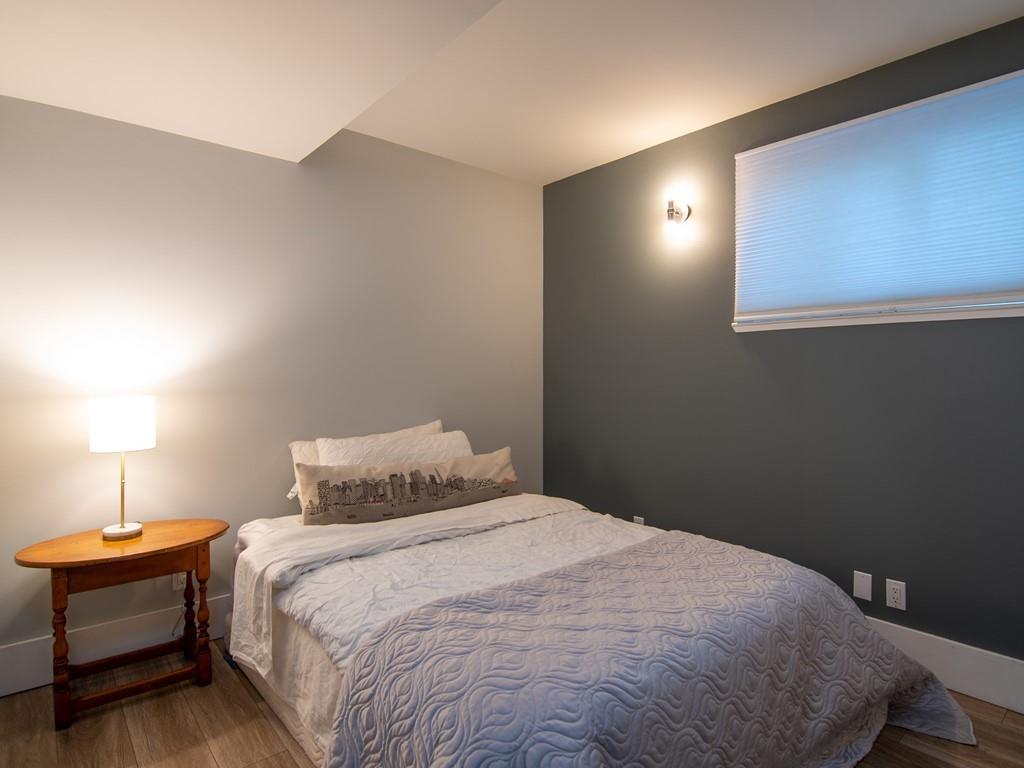 3600 Tripp Road Woodside, CA 94062 - Photo 22 of 27 a bedroom with a bed and a lamp