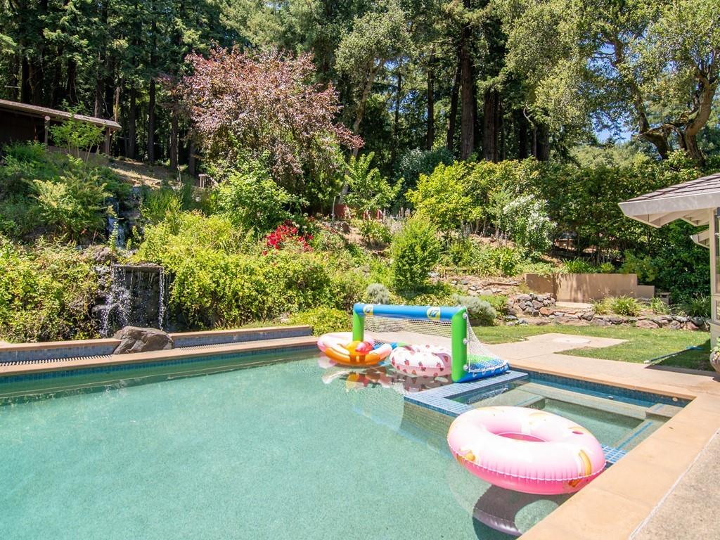 3600 Tripp Road Woodside, CA 94062 - Photo 25 of 27 a wooden bench sitting in the middle of a yard