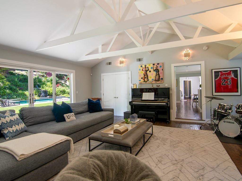 3600 Tripp Road Woodside, CA 94062 - Photo 6 of 27 a living room with furniture and a flat screen tv