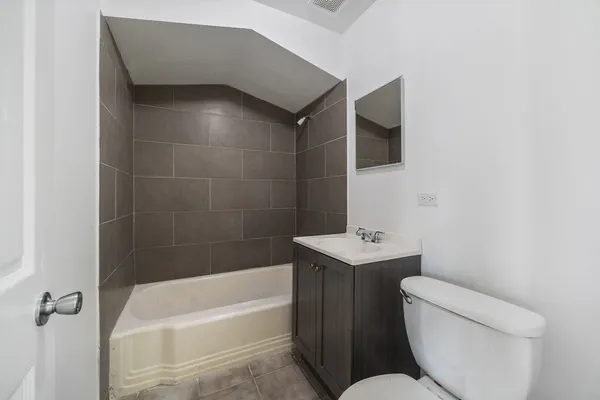 a bathroom with a sink toilet and bathtub