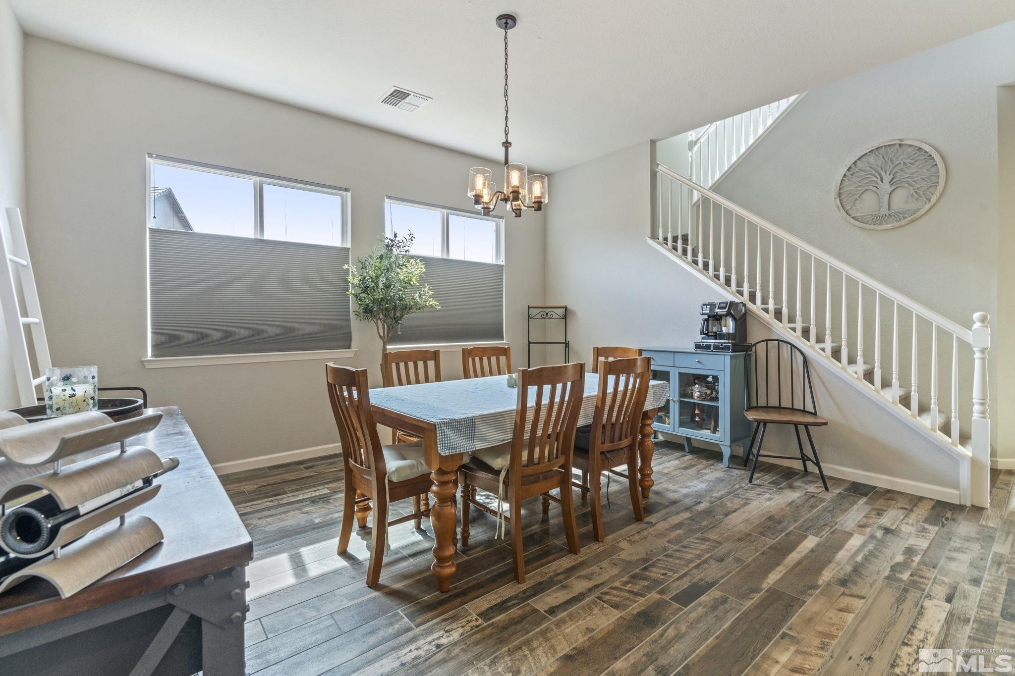 2305 Buttermere Drive Reno, NV 89521 - Photo 12 of 39 a view of a dining room with furniture window and wooden floor