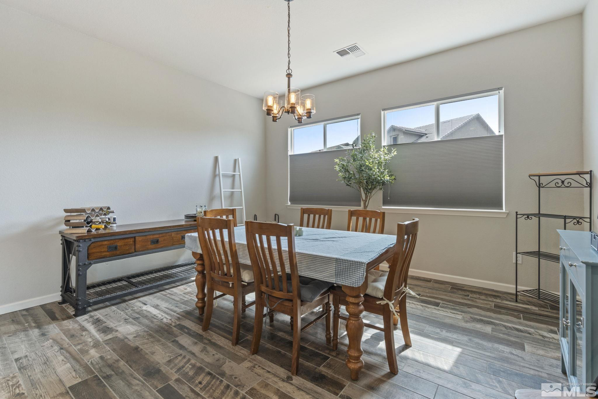 2305 Buttermere Drive Reno, NV 89521 - Photo 13 of 39 a view of a dining room with furniture window and wooden floor