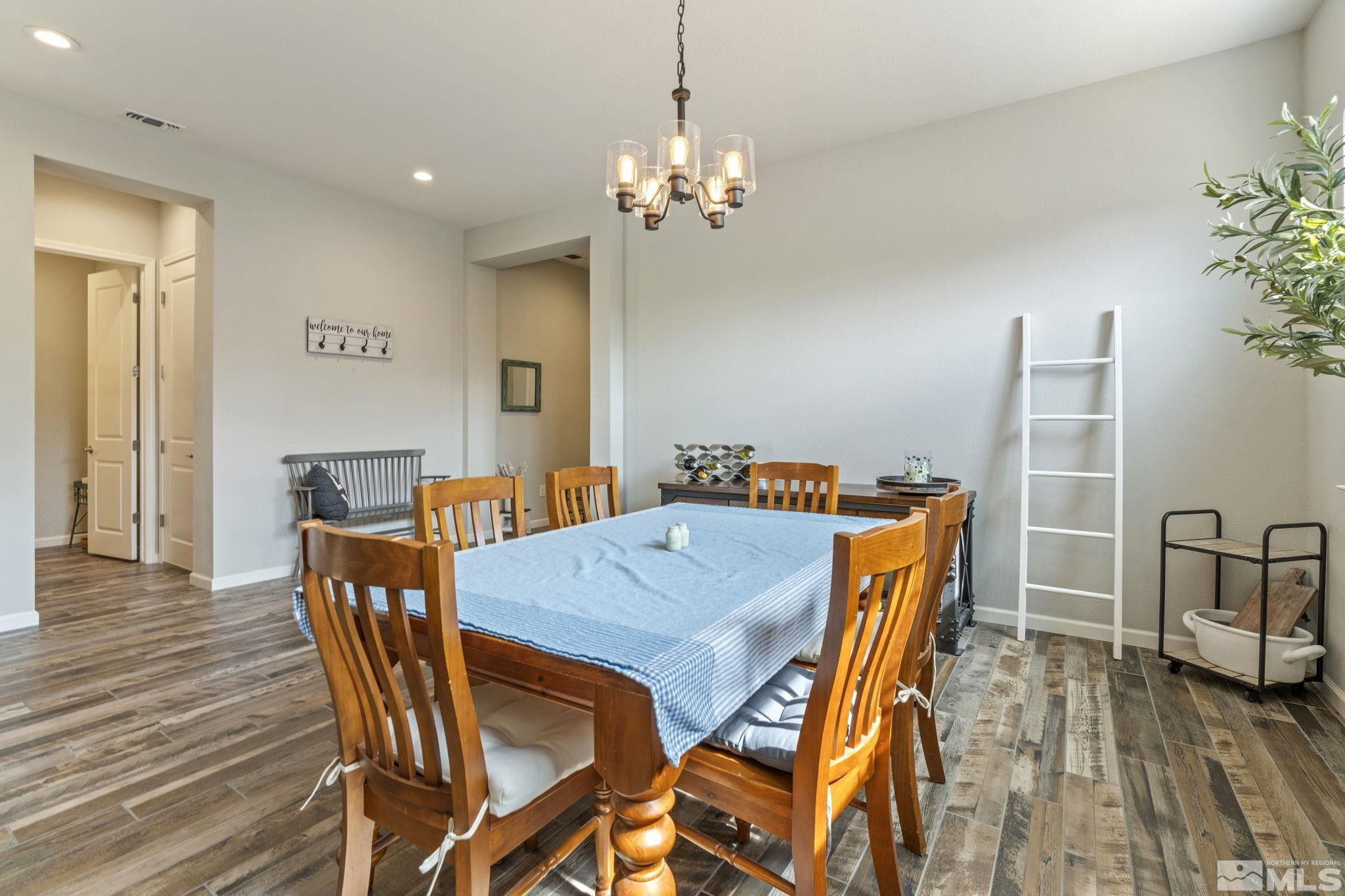 2305 Buttermere Drive Reno, NV 89521 - Photo 14 of 39 a view of a dining room with furniture and wooden floor