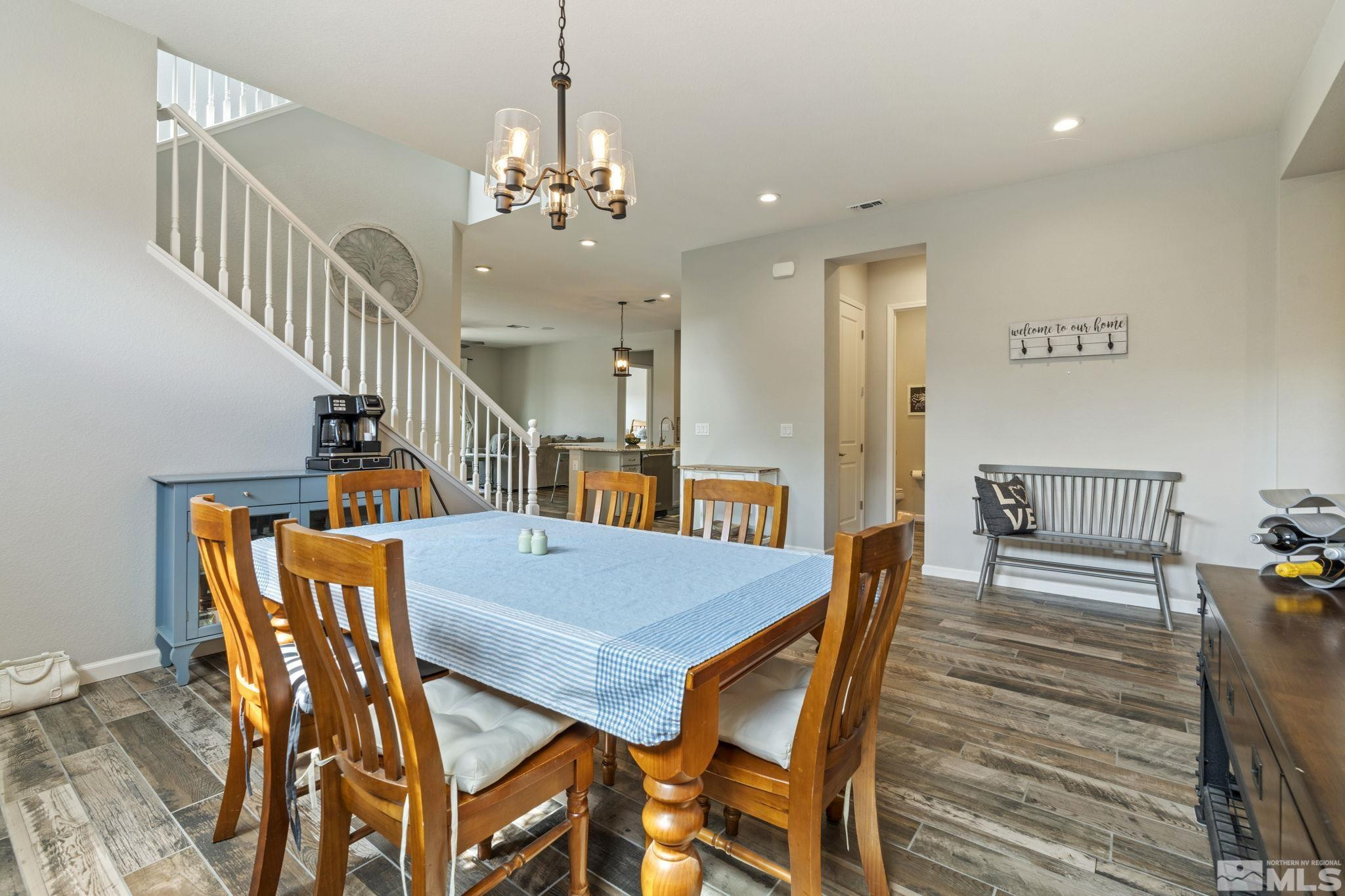 2305 Buttermere Drive Reno, NV 89521 - Photo 15 of 39 a view of a dining room with furniture and wooden floor