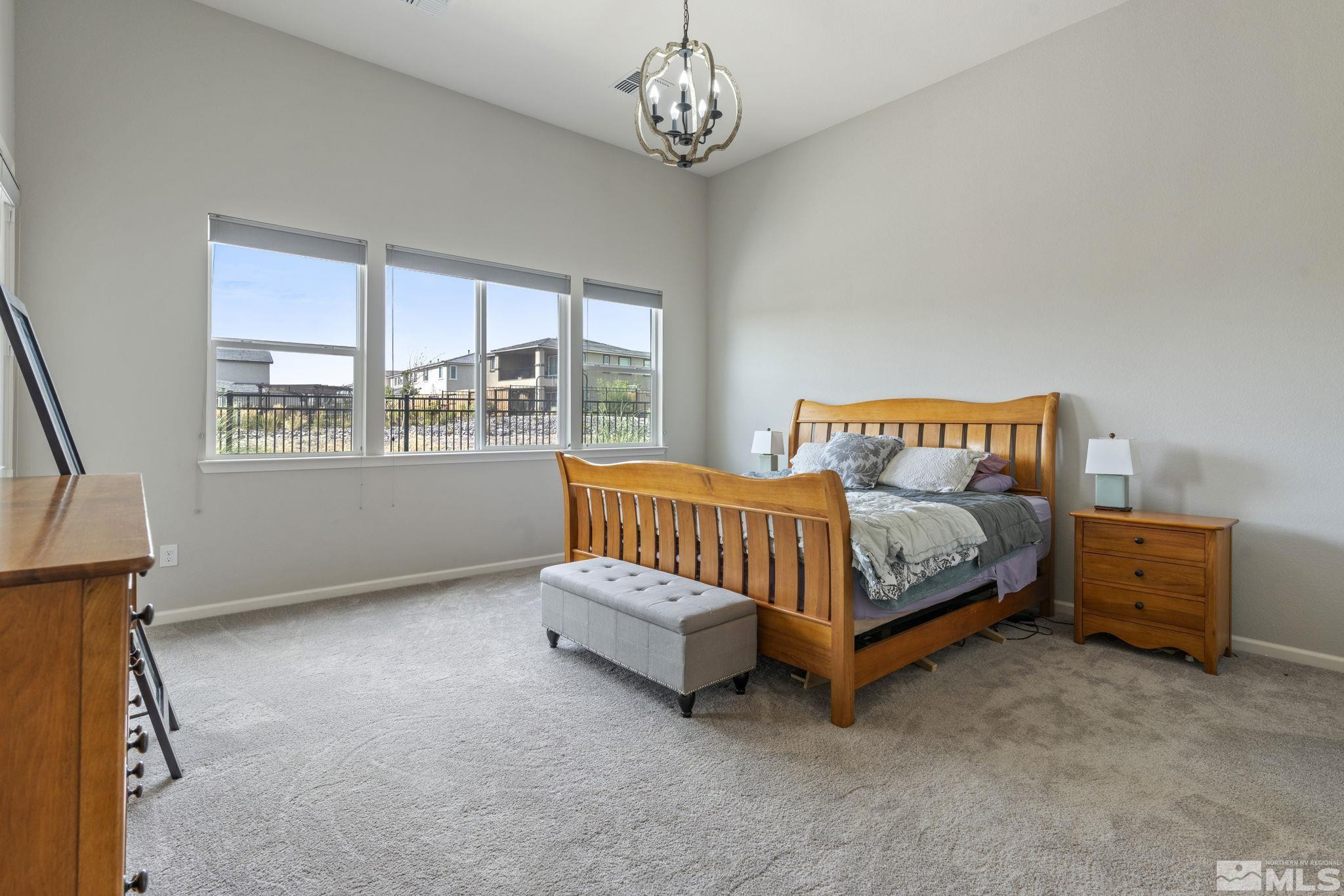 2305 Buttermere Drive Reno, NV 89521 - Photo 16 of 39 a bedroom with a bed and a window