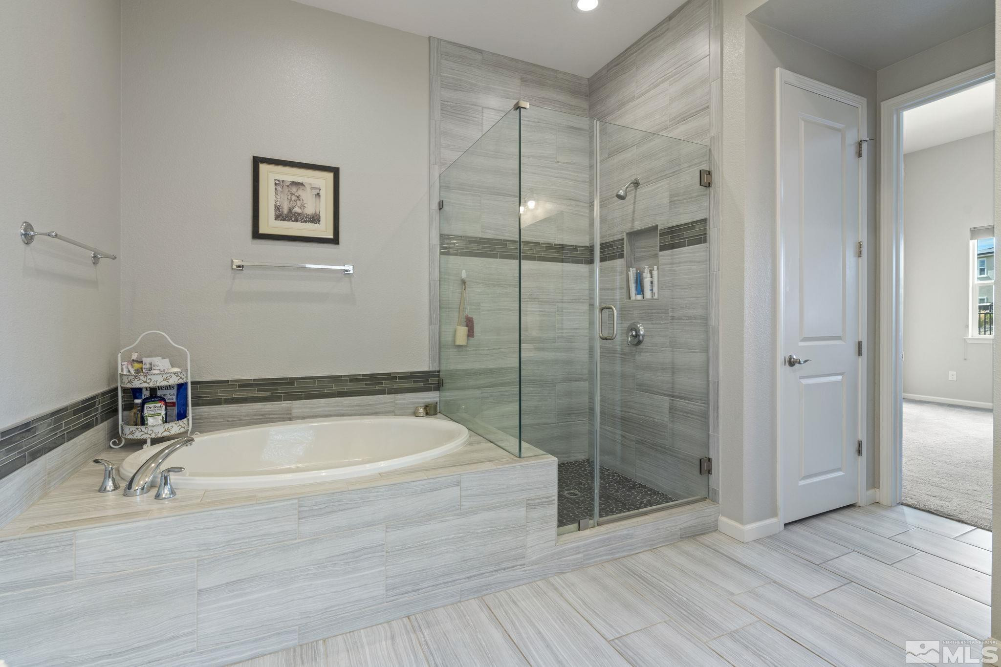2305 Buttermere Drive Reno, NV 89521 - Photo 19 of 39 a bathroom with a bathtub and shower
