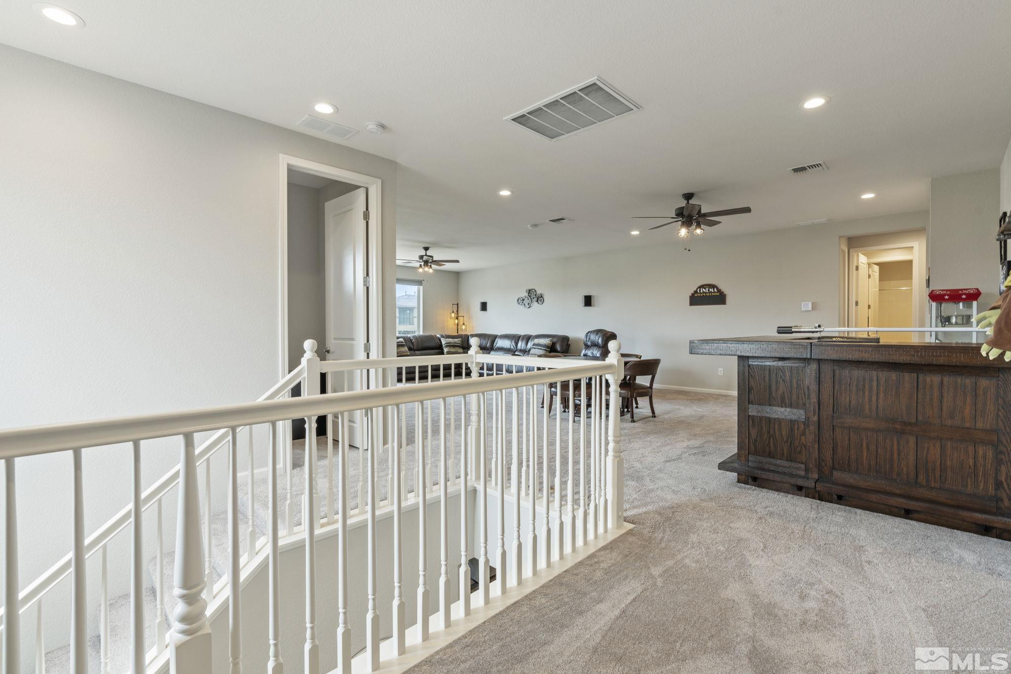 2305 Buttermere Drive Reno, NV 89521 - Photo 21 of 39 a view of a kitchen with kitchen island white wooden cabinets and stainless steel appliances