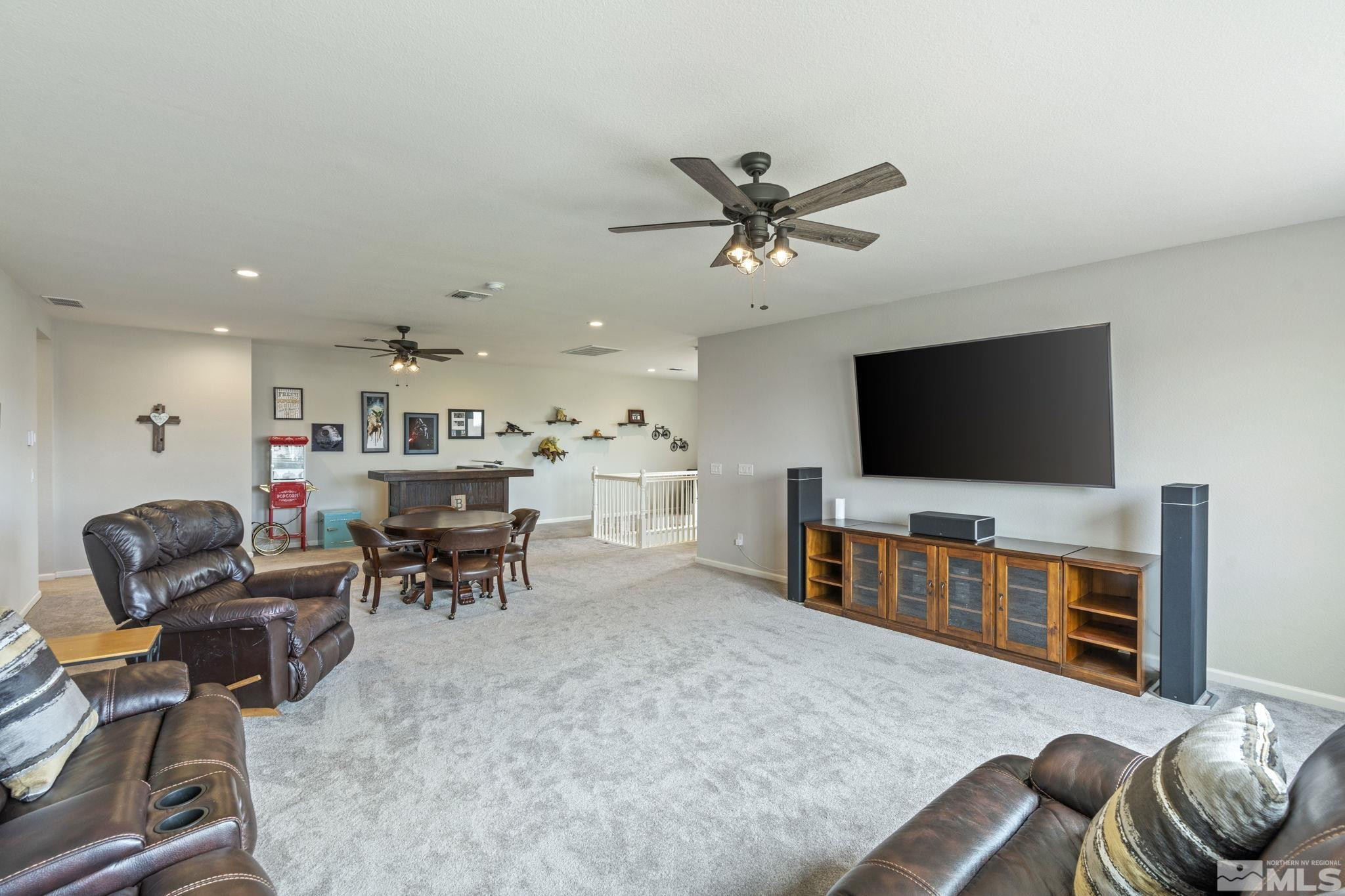 2305 Buttermere Drive Reno, NV 89521 - Photo 25 of 39 a living room with furniture and a flat screen tv