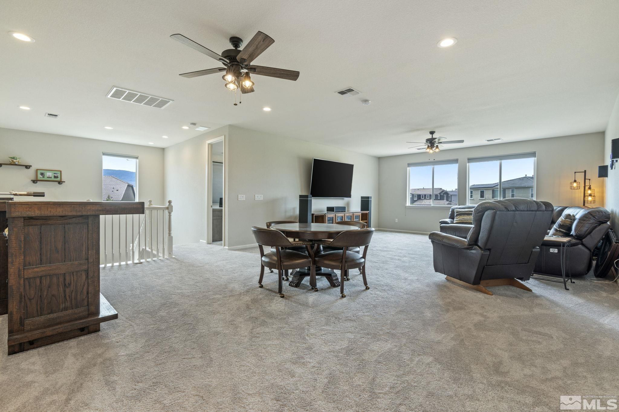 2305 Buttermere Drive Reno, NV 89521 - Photo 26 of 39 a living room with furniture and a flat screen tv