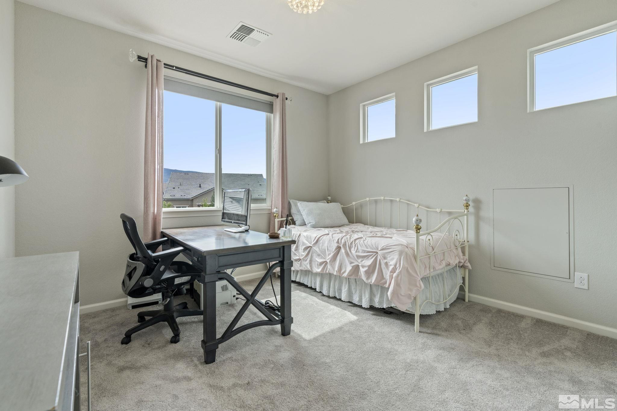 2305 Buttermere Drive Reno, NV 89521 - Photo 28 of 39 a bedroom with a bed and a table