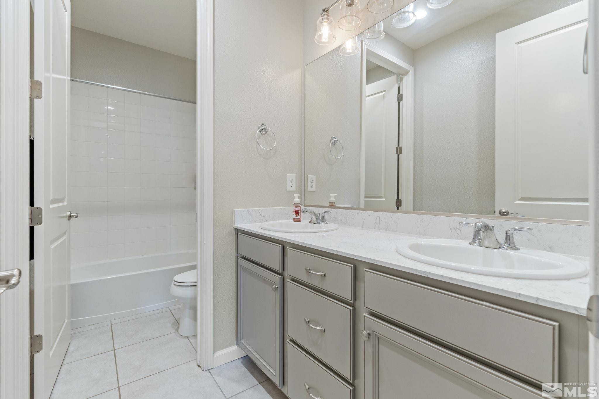 2305 Buttermere Drive Reno, NV 89521 - Photo 29 of 39 a bathroom with a sink a toilet and shower