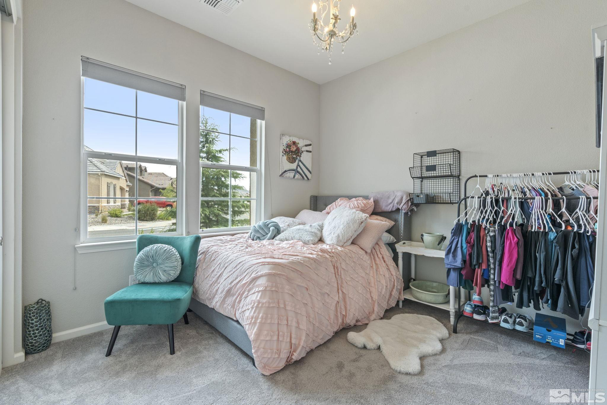 2305 Buttermere Drive Reno, NV 89521 - Photo 32 of 39 a bedroom with a bed and a window
