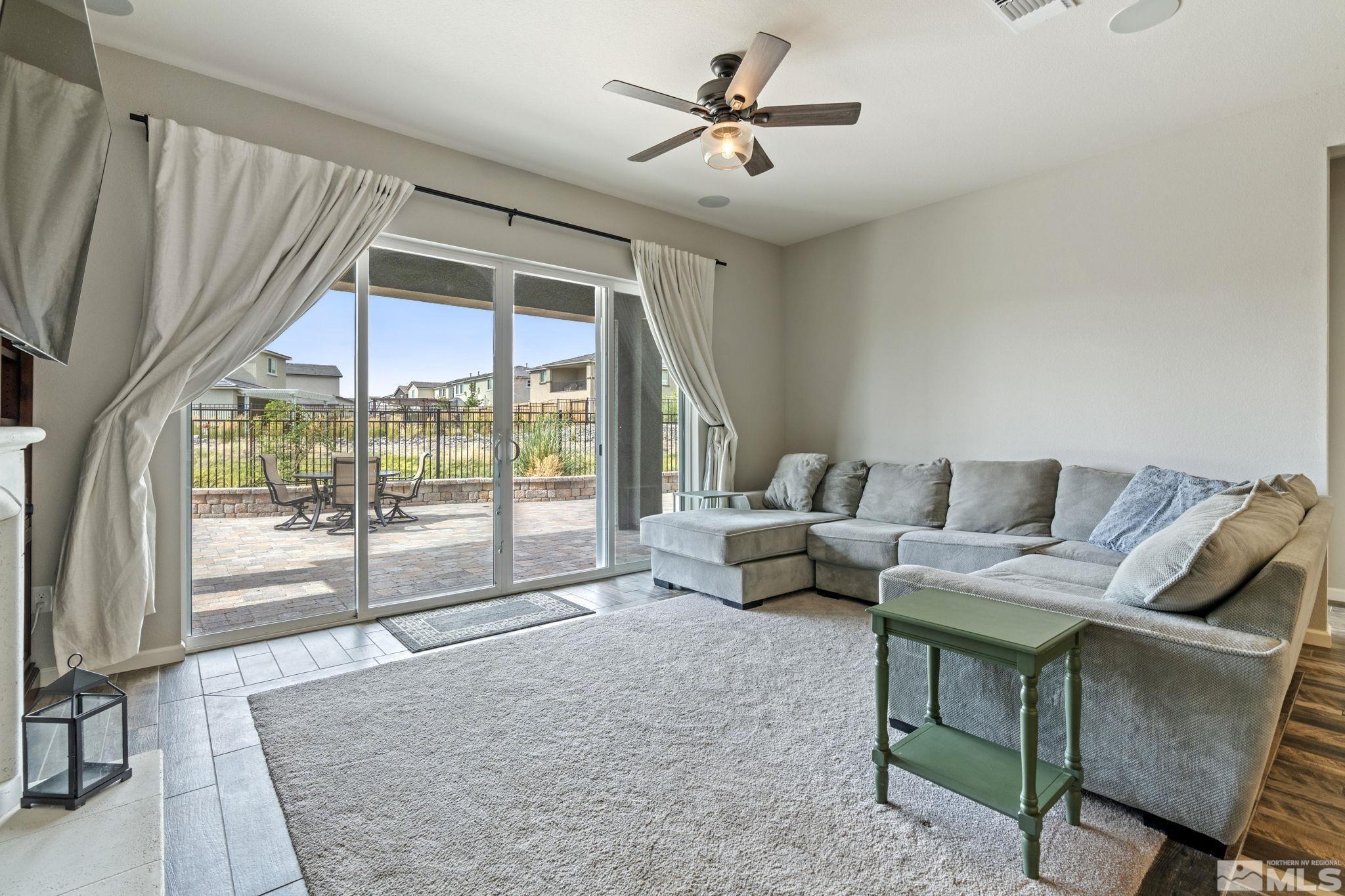 2305 Buttermere Drive Reno, NV 89521 - Photo 8 of 39 a living room with furniture and a large window