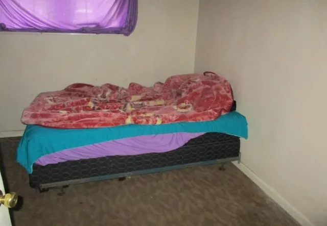 a bed room with a bed and a couch