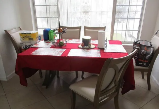 a dining room with furniture and window