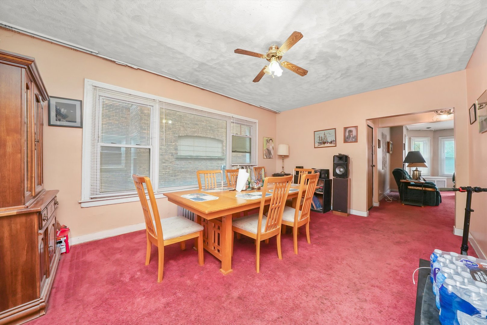 7825 South Phillips Avenue Chicago, IL 60649 - Photo 14 of 55 a view of a dining room with furniture and a chandelier